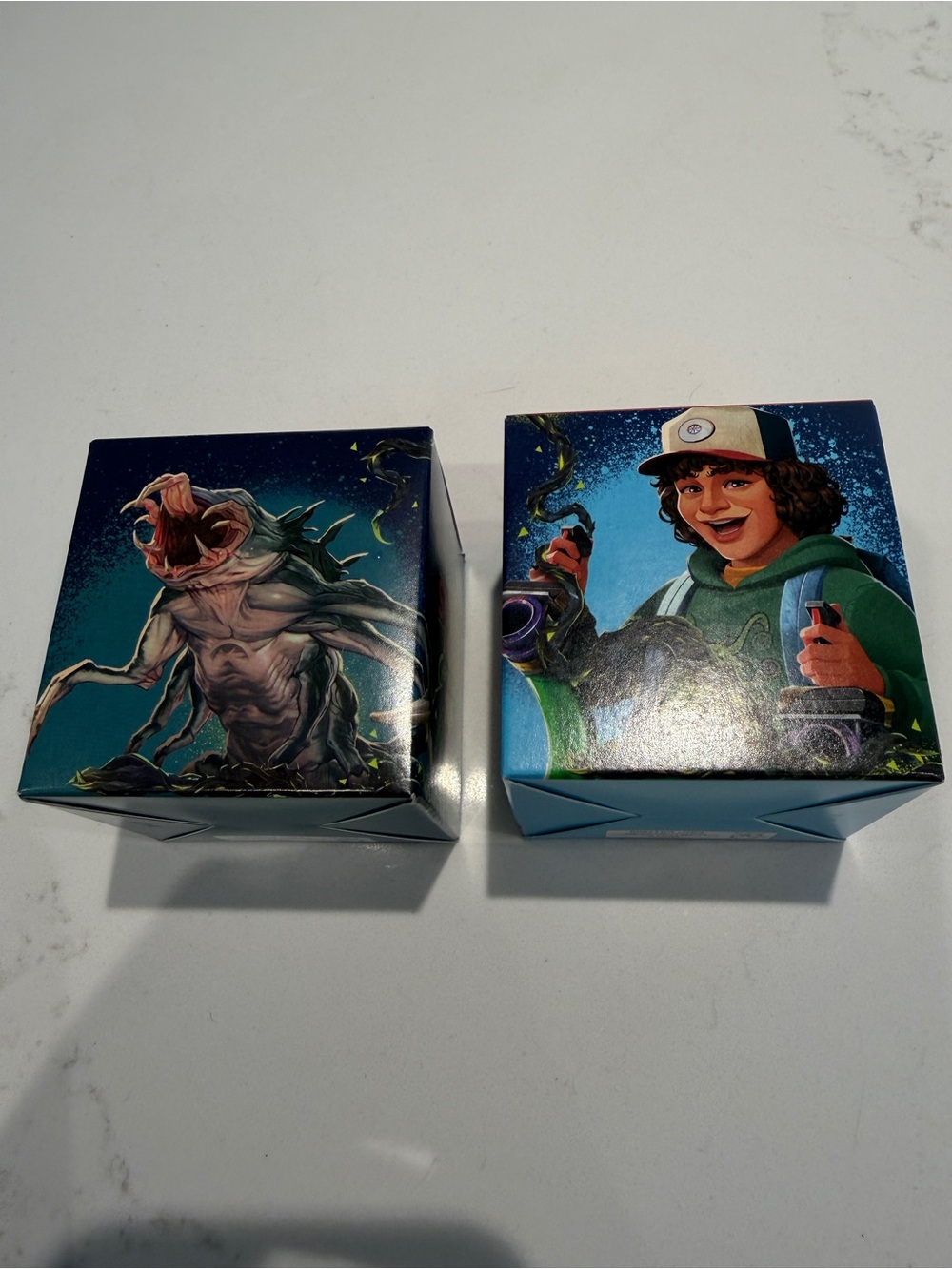 Stranger Things: Collectible Game Art Deck Boxes — Teal & Blue Graphic Design